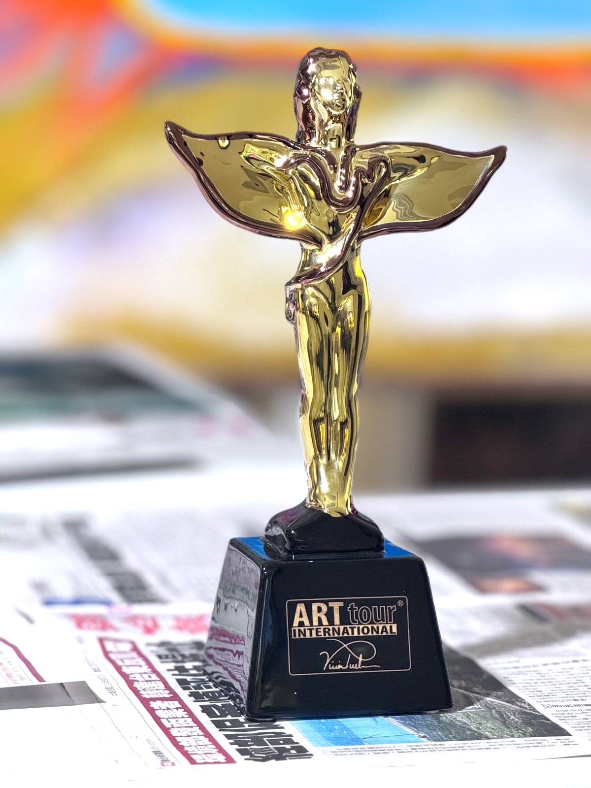 The Art Titans Award, an original winged sculpture designed by Viviana Puello