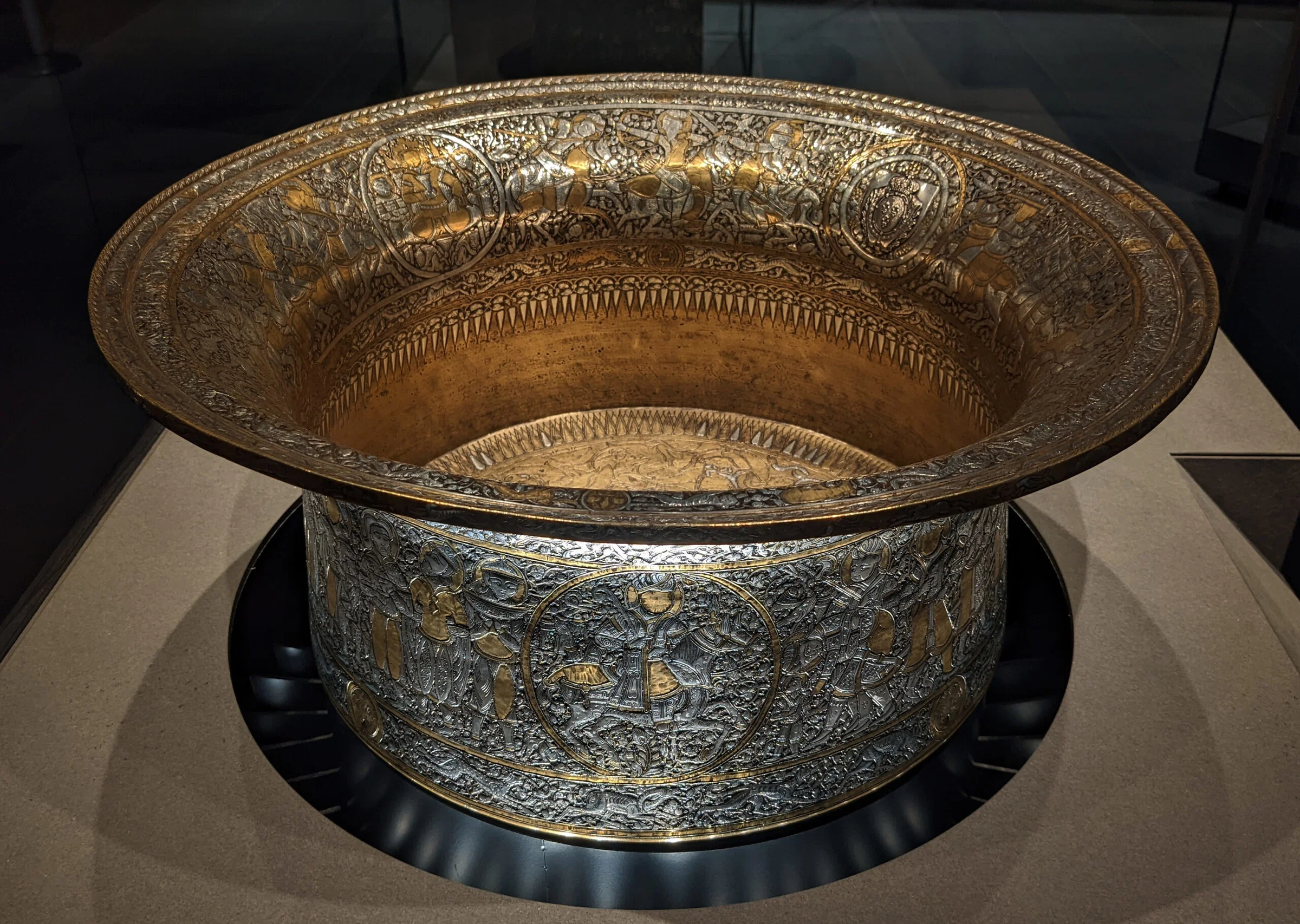 Field: featured image Inlaid metal basin known as the Baptistery of Saint Louis displayed in the Louvre’s Islamic art galleries