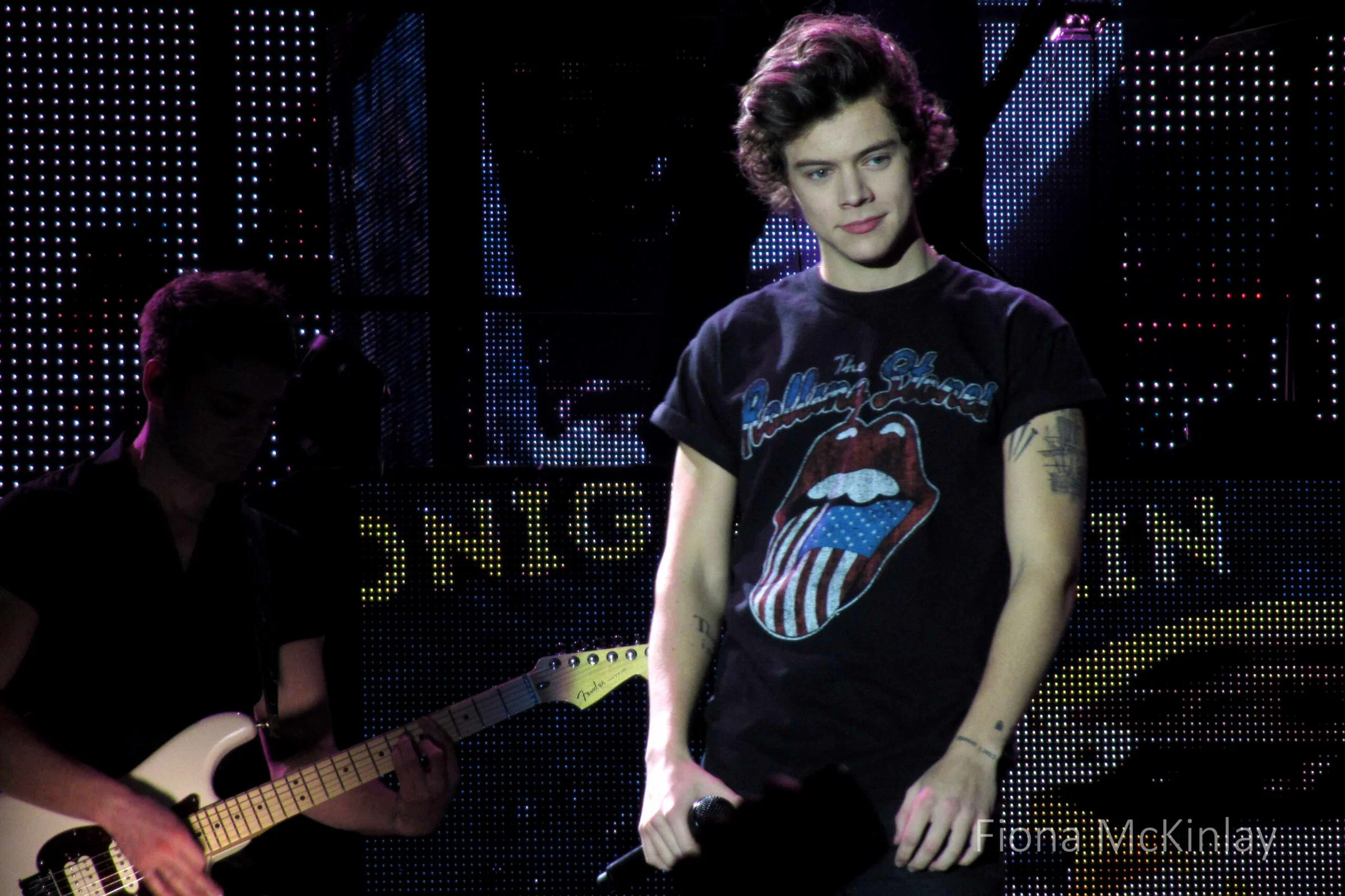 Field: featured image Harry Styles performing onstage in Glasgow during the Take Me Home Tour in 2013