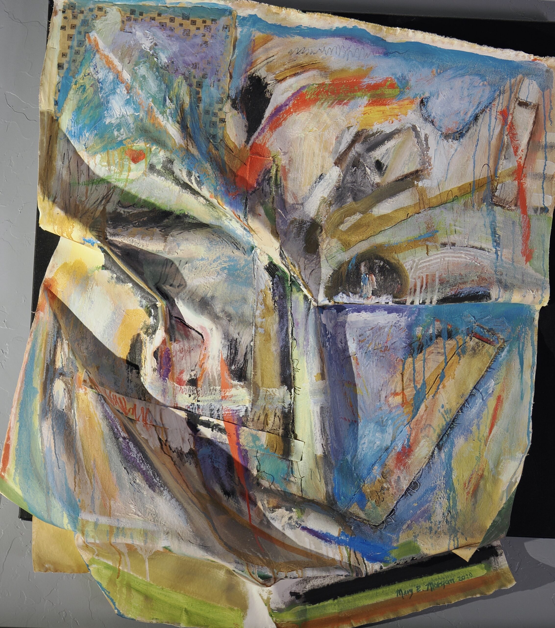 Mary E Morgan: The Landscapes We Carry Within | ArtTour International Folded painted canvas creates a sculptural abstract relief in blue, gold, white, and red.