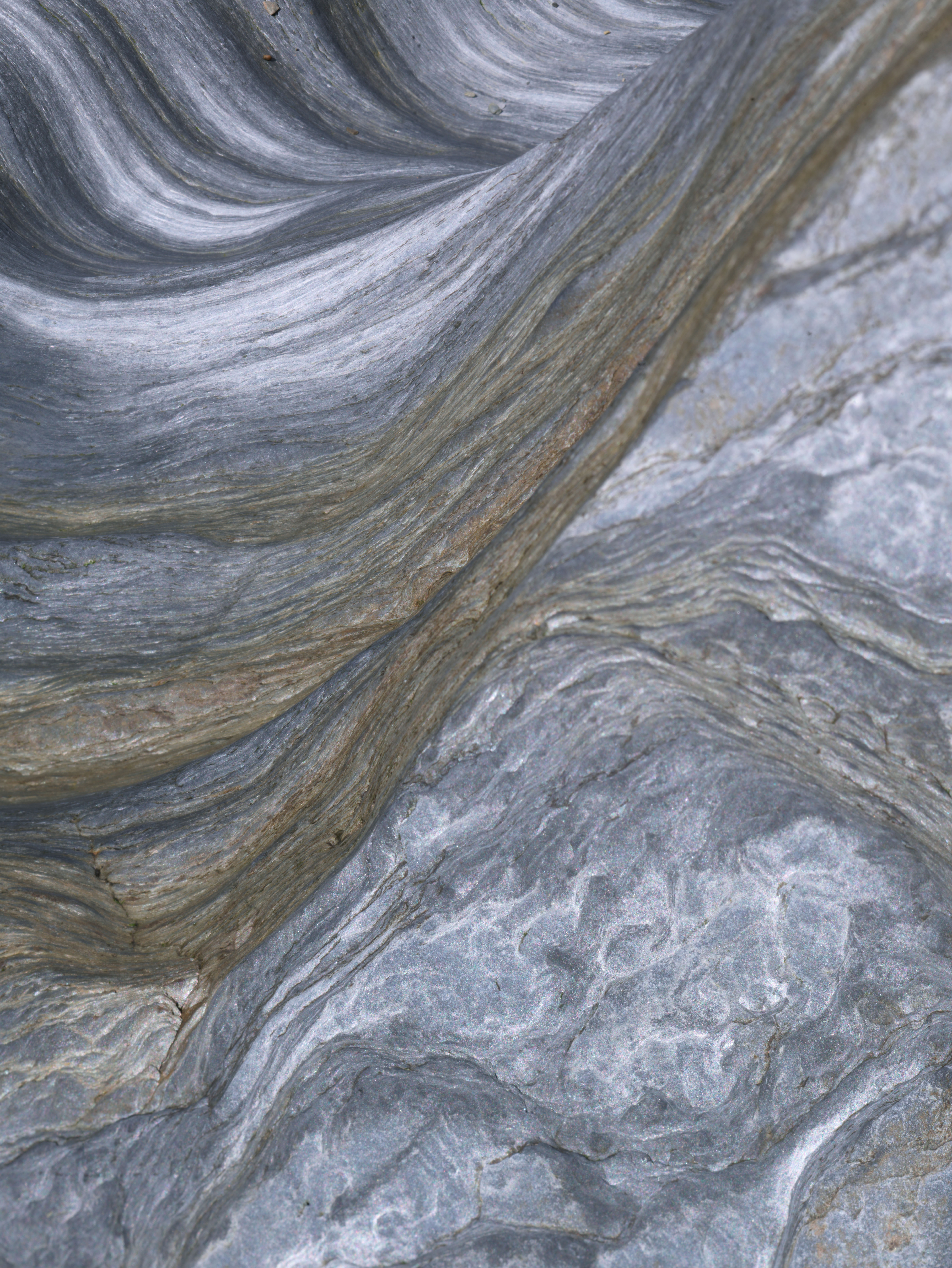 Despina Kyriacou: Nature Seen Through Its Own Patterns | ArtTour International Diagonal layered striations crossing a pale gray natural surface with interwoven fine patterns.