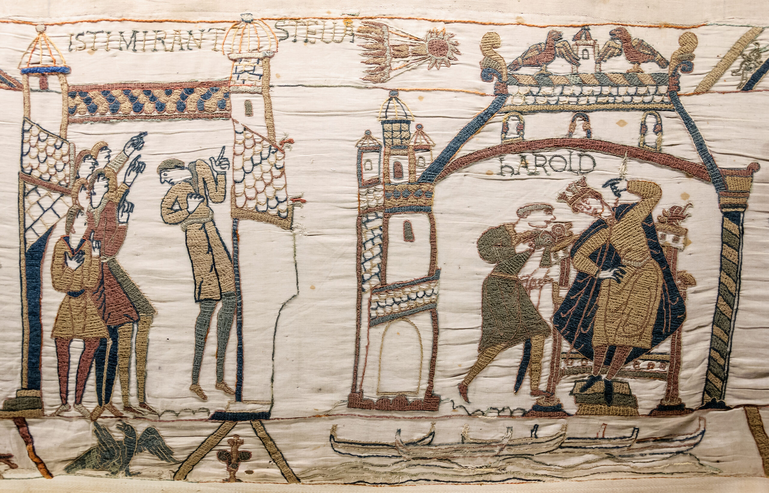 Field: featured image Historic embroidered scene from the Bayeux Tapestry showing figures looking upward toward Halley’s Comet.