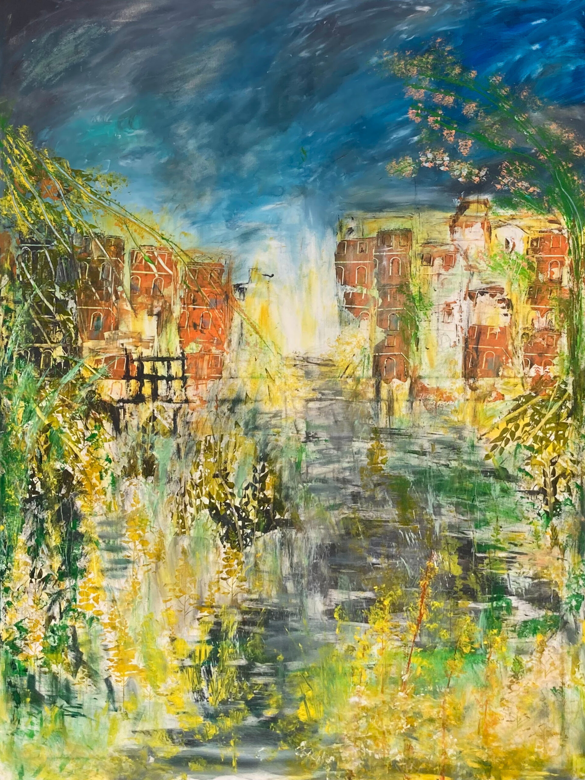 A. Lang: A City Felt Through Color | ArtTour International Loose yellow and green garden growth beneath a blue sky, with red-brown buildings and a pale opening in the center.