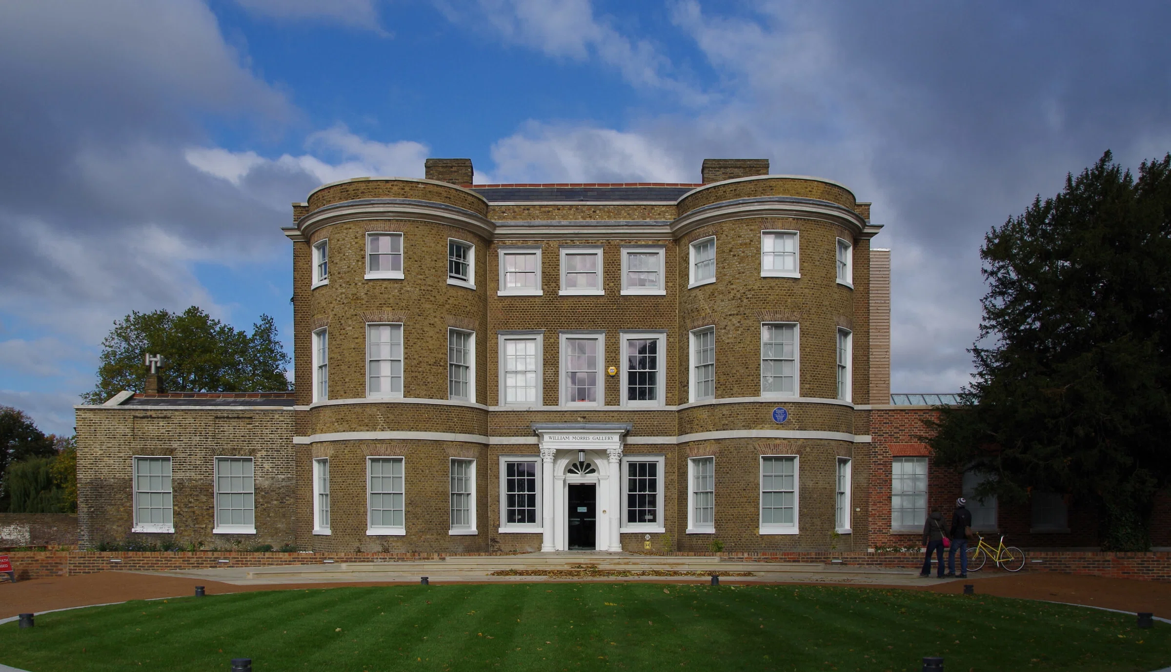 Exterior of the William Morris Gallery, a red-brick Georgian house in Walthamstow, London.