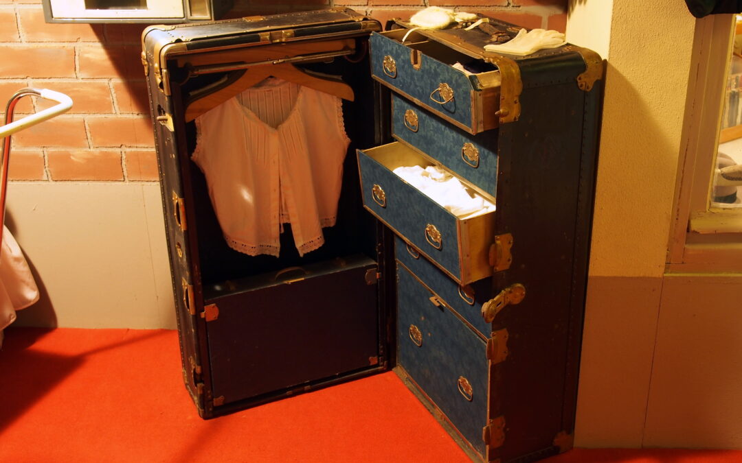 Large historic cabin trunk with worn leather fittings
