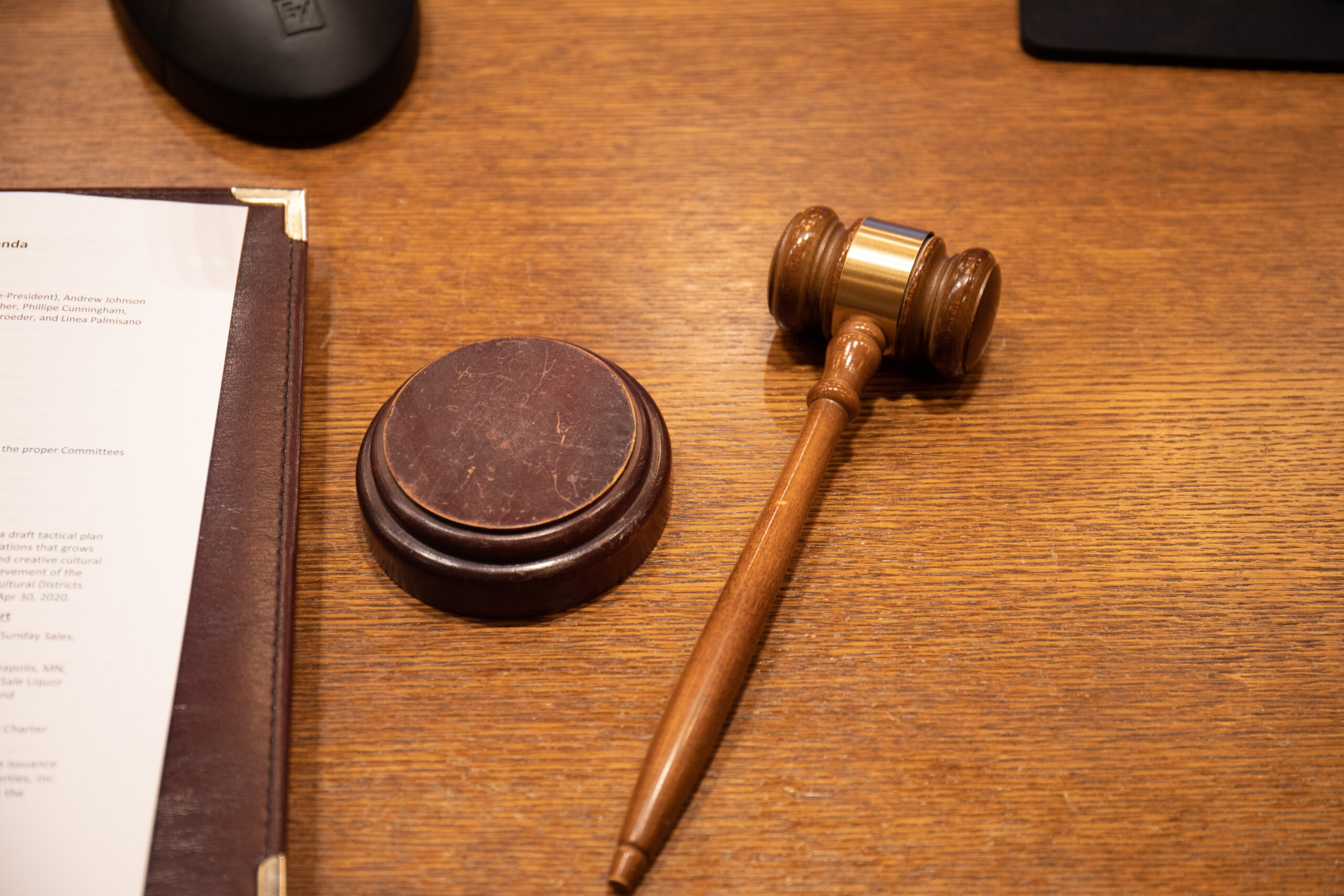 Field: featured image Close-up of a wooden gavel resting on a desk