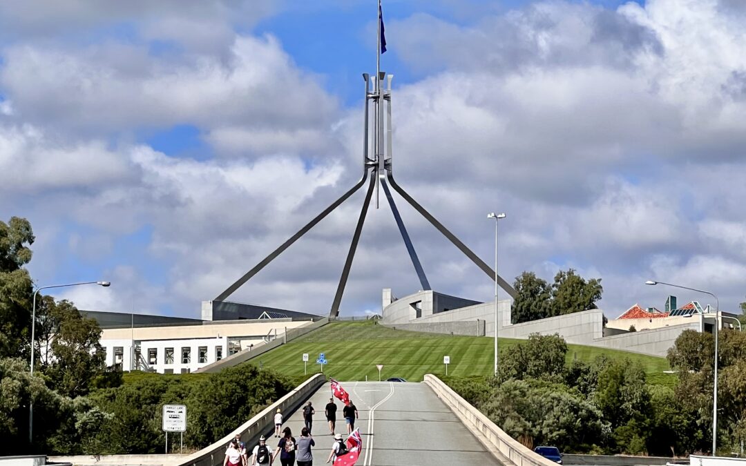 Exterior of Parliament House in Canberra beneath a clear blue sky