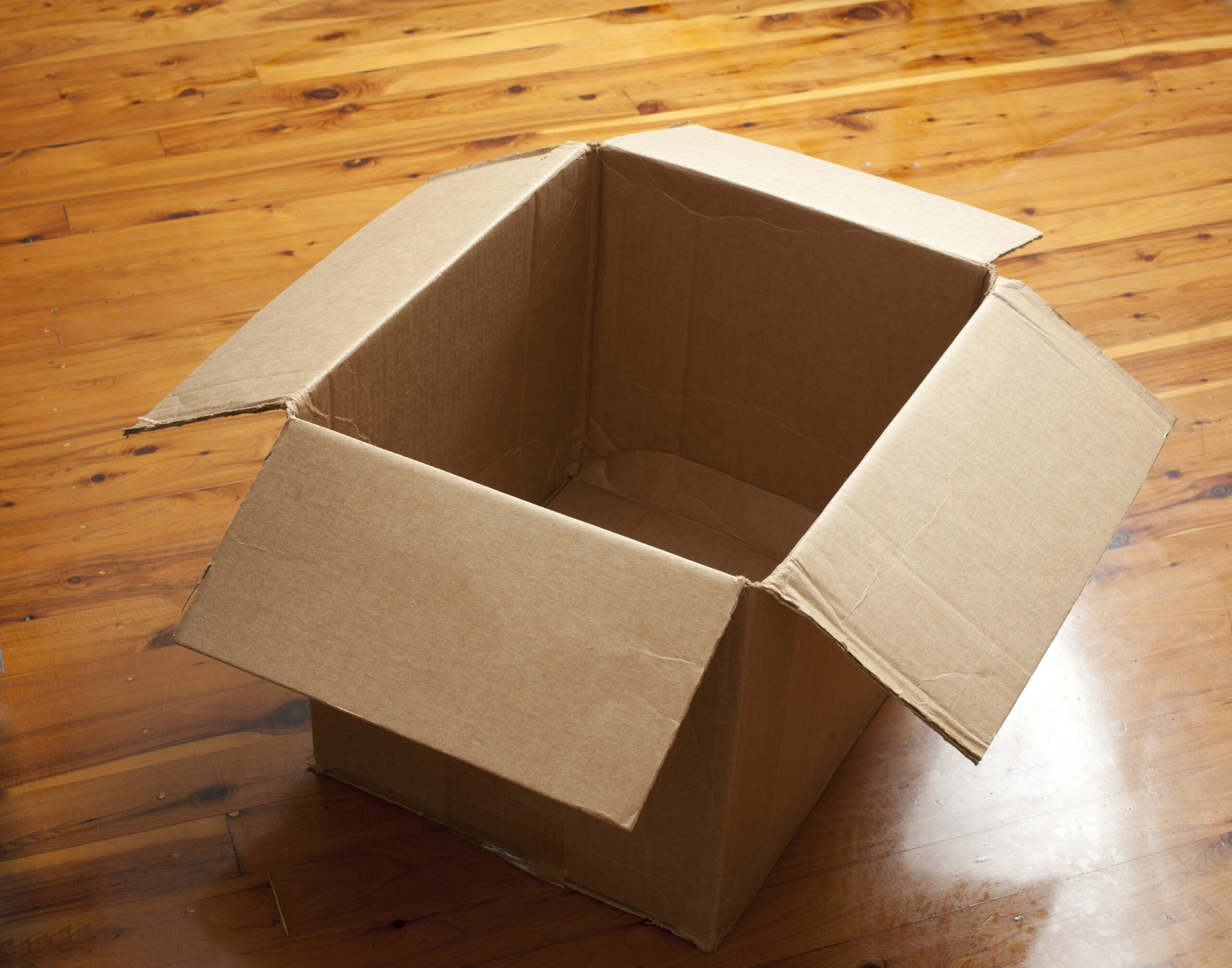 Field: featured image Stack of flattened cardboard boxes ready for reuse or recycling