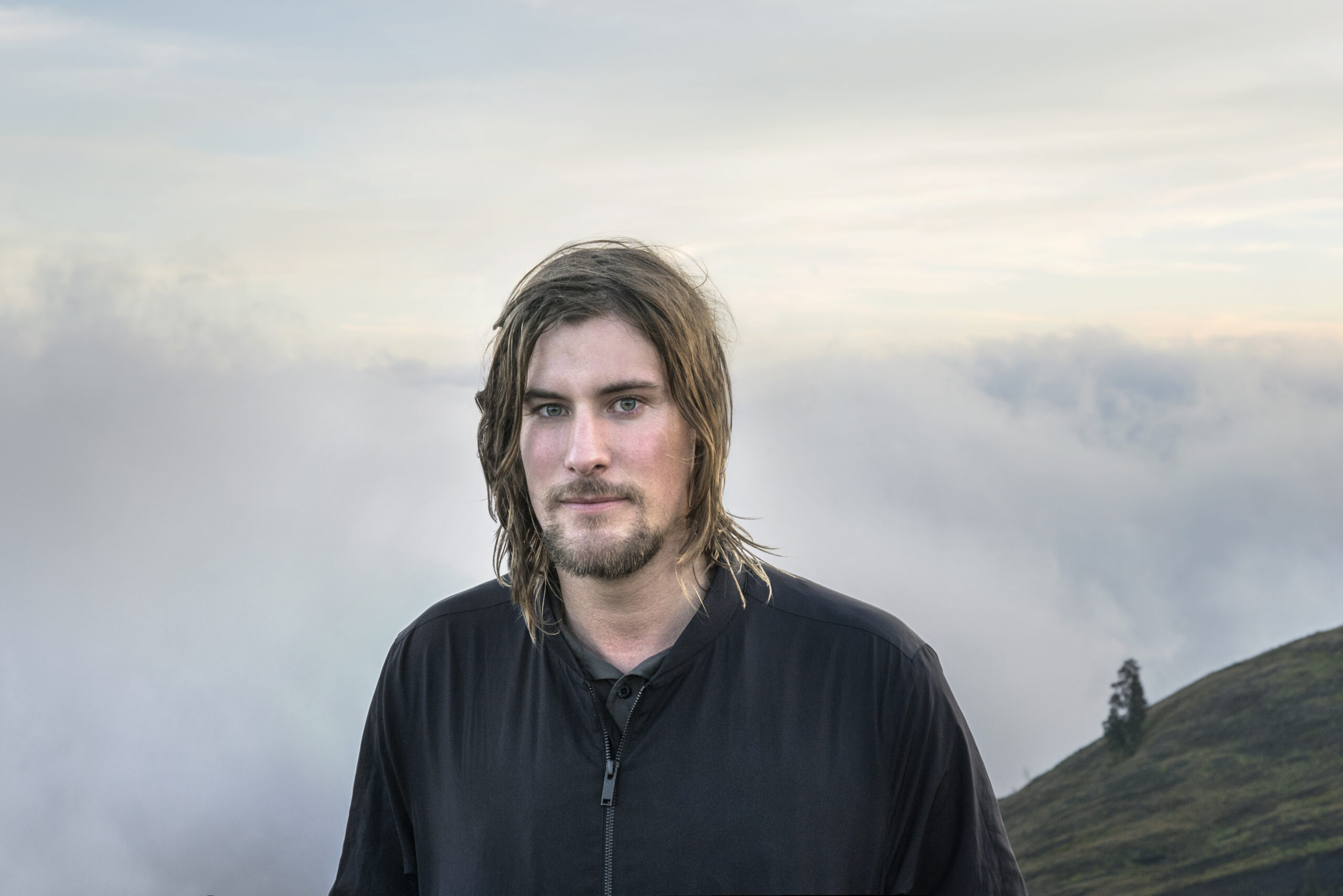 Field: featured image Artist Julian Charrière speaking in a gallery setting