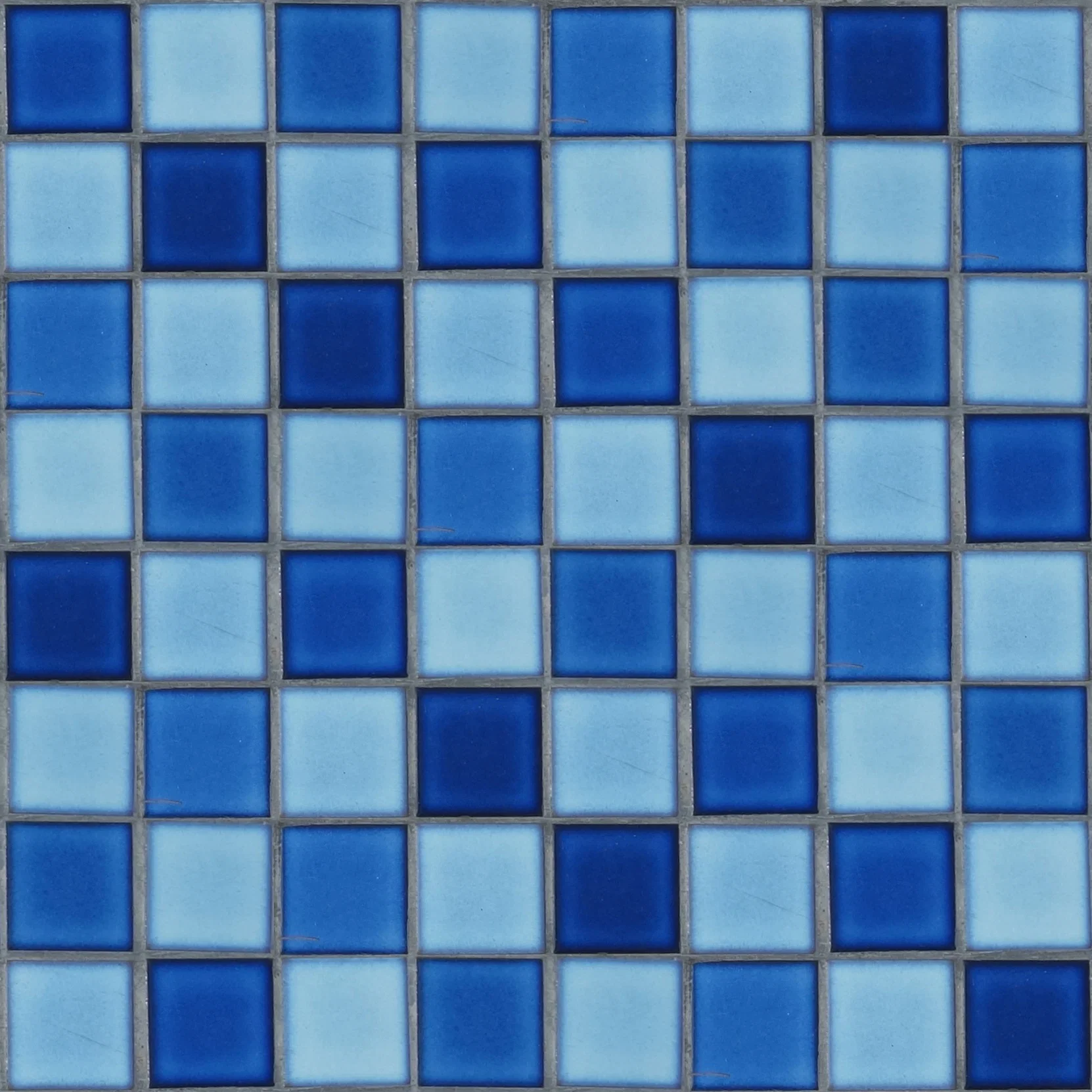 Field: featured image Close view of small blue mosaic swimming-pool tiles