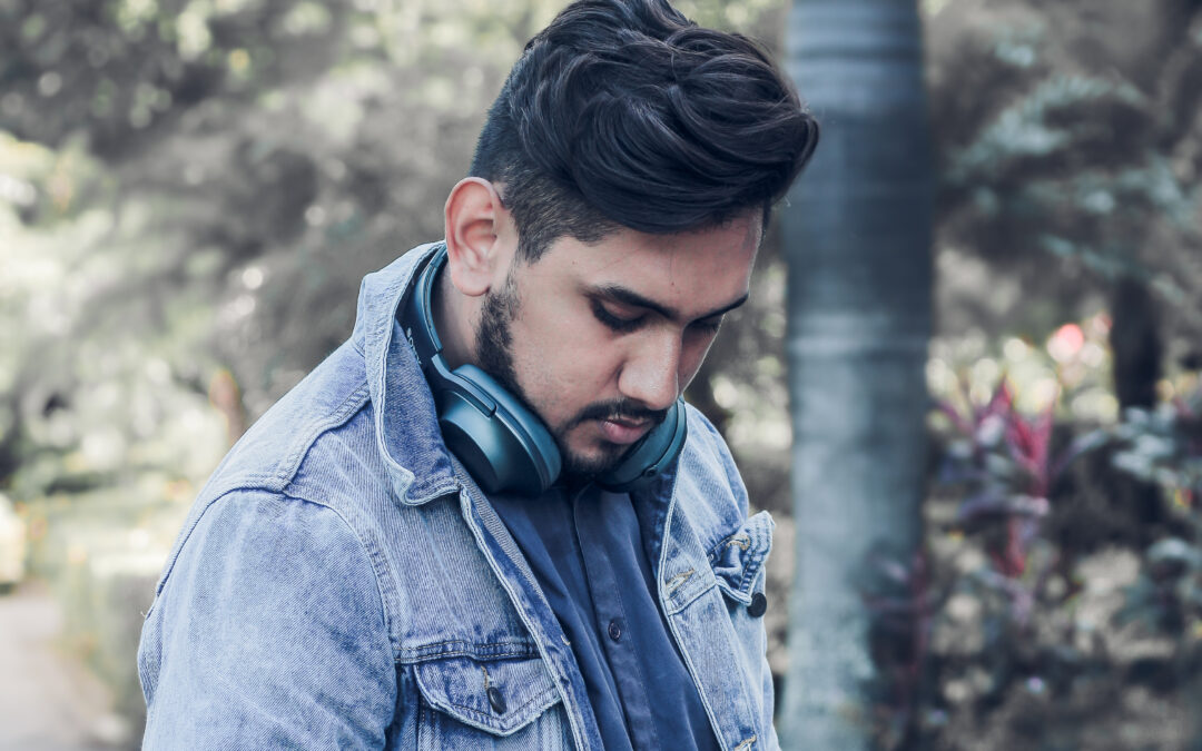 Person wearing headphones around the neck